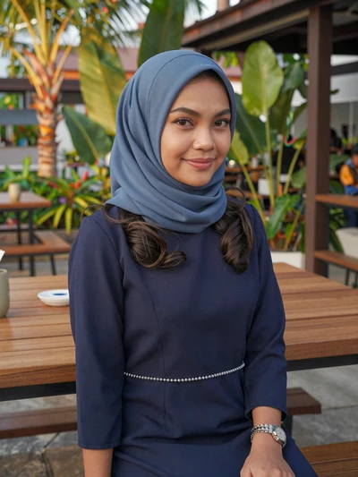Siti Hajar, 29-year-old professional Bruneian woman in modest navy dress ready for meaningful connection