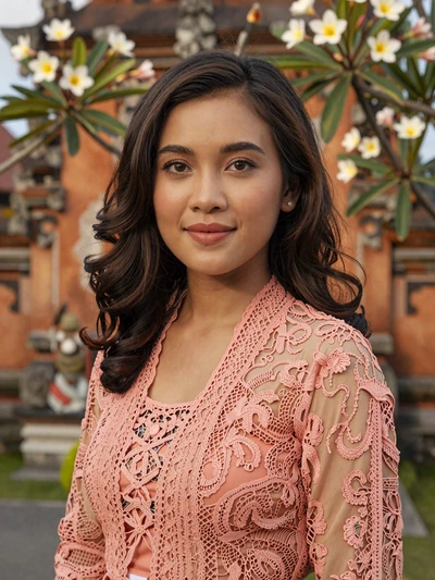 Dewi Anggraeni, 28-year-old Balinese woman with serene expression seeking Western partner