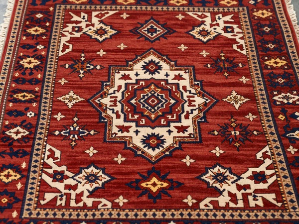 Traditional Turkmen carpet with intricate gul patterns representing tribal heritage